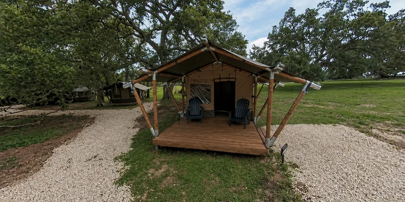 Safari tent with porch chairs