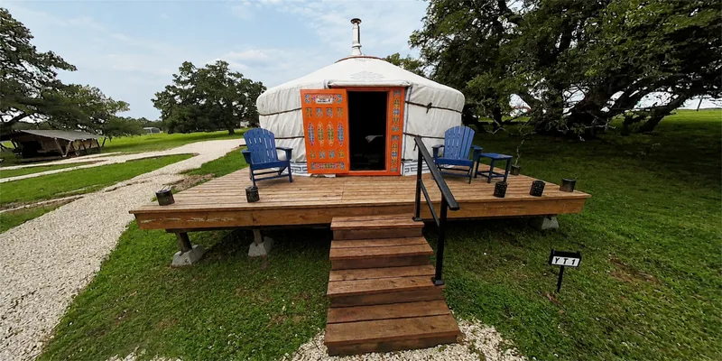 Mongolian yurt with a painted orange door