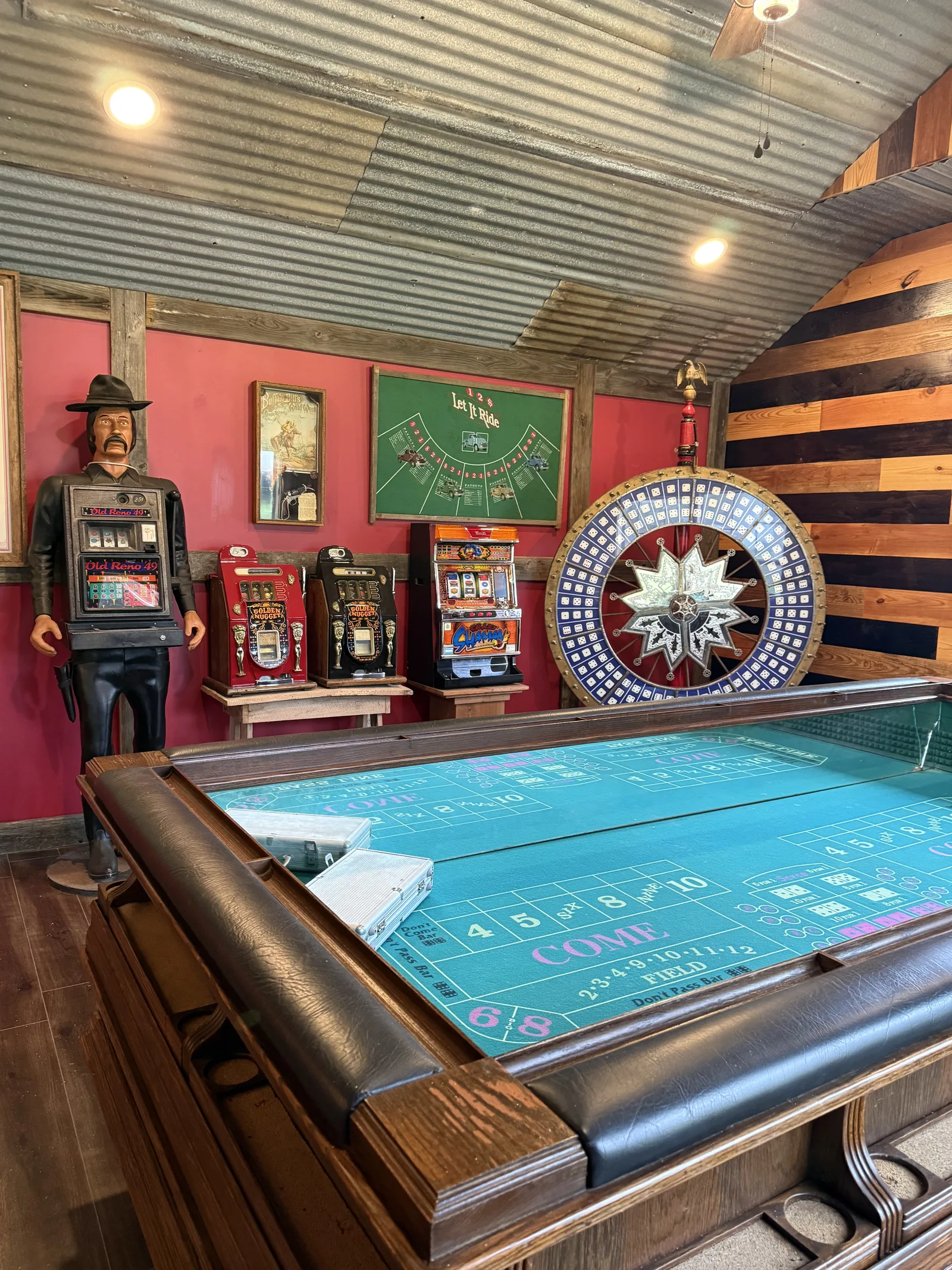 Antique slot machines and a wheel of fortune in the casino